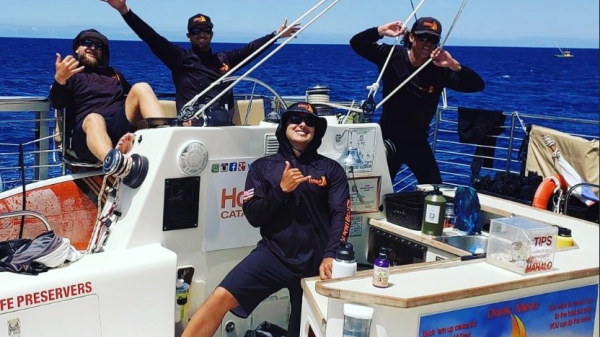 a group of people on a boat in the water